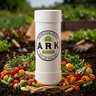 A white cylindrical container with a label that reads 'ARK Heirloom Seeds, All-In-One Kit', containing various seeds for plants and vegetables.